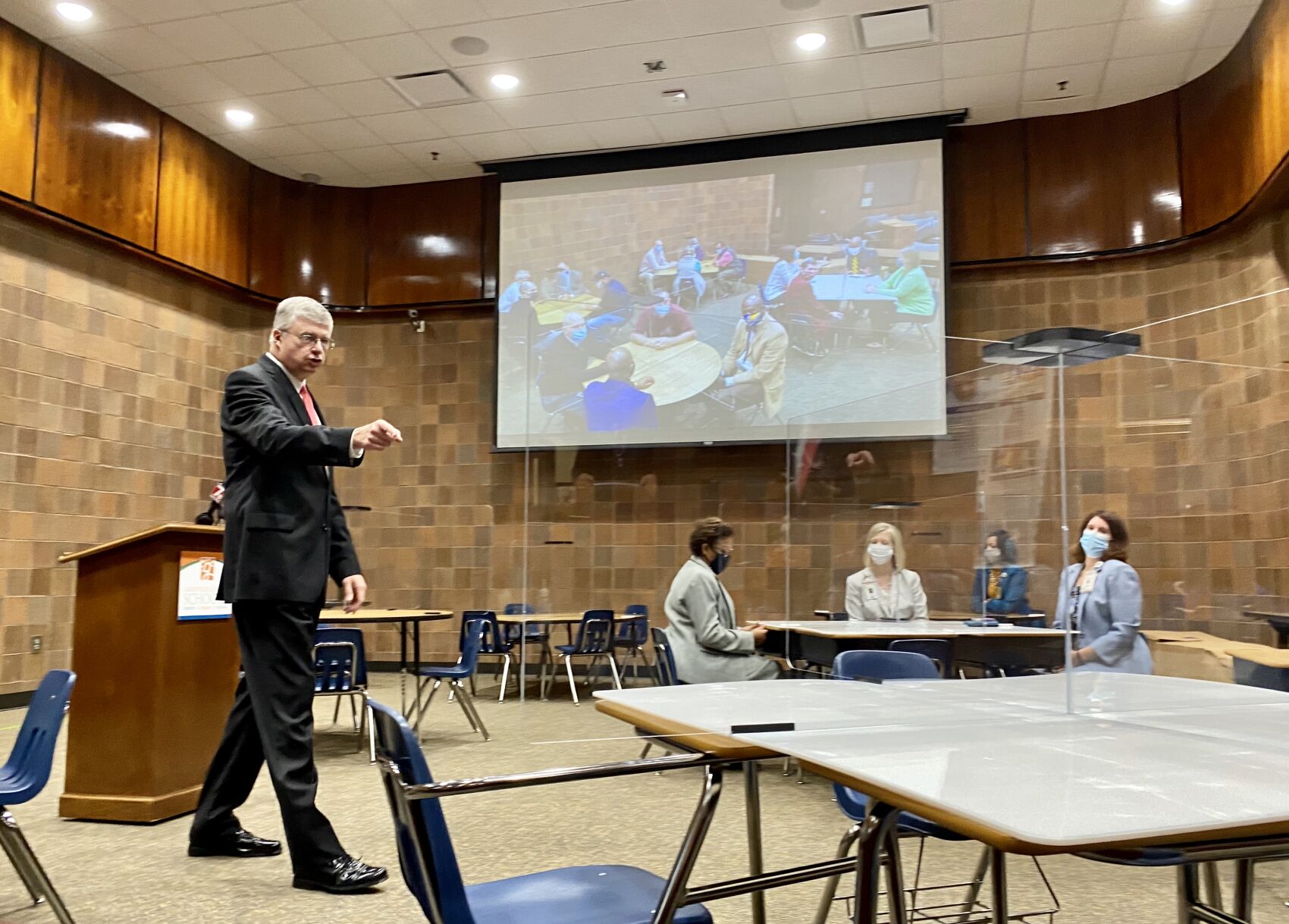 Greenville County Schools Superintendent Burke Royster explains plexiglass barriers